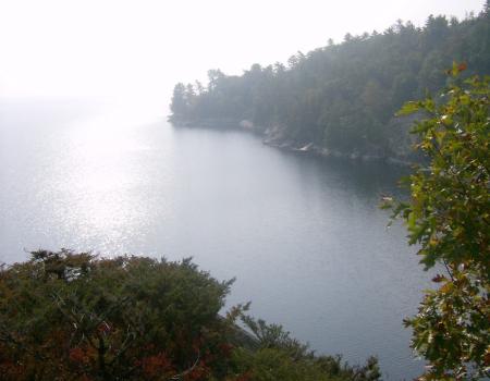 The view of a lake bay from on top of a cliff