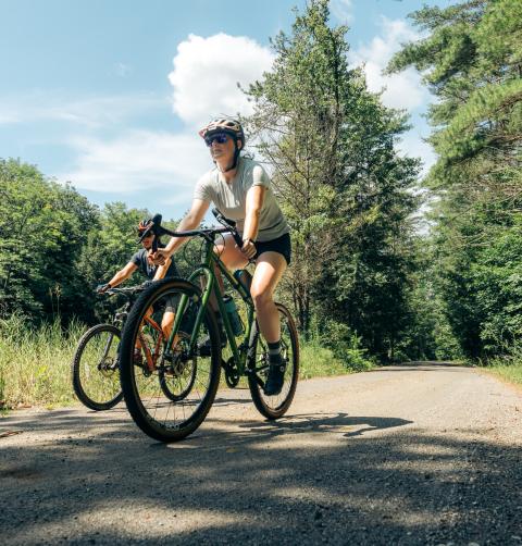 Two gravel bikers on a dirt road.