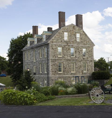 Fort Ticonderoga building view with outdoor scenery on a summer day.