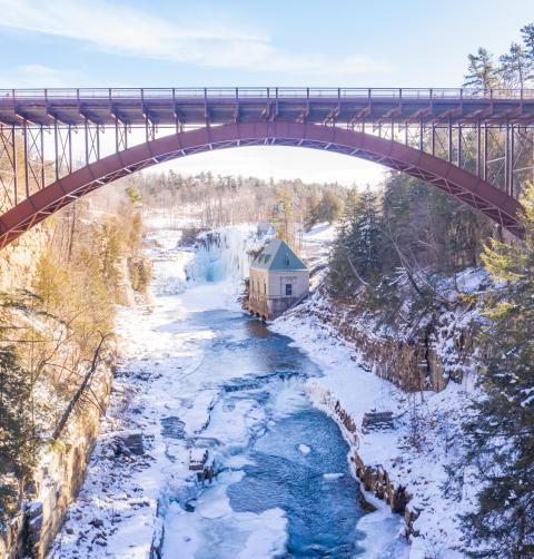 A view of the waterfall at ausable chasm in the winter.