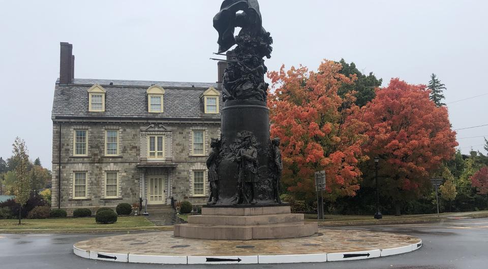 A large stone building and statue