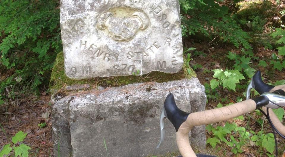 The stone with an image of the two shaking hands.