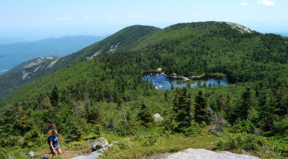 A high elevation lake appears on the way to the summit.