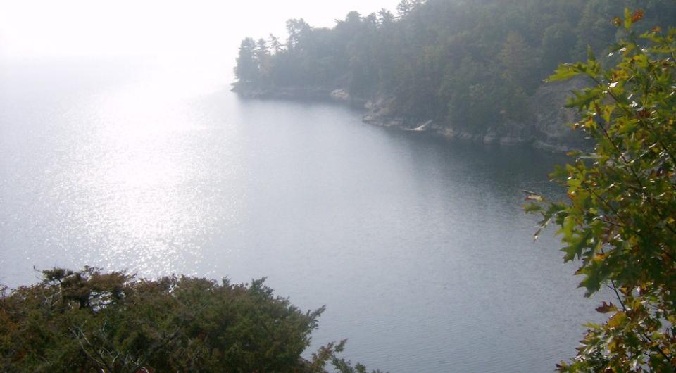 The view of a lake bay from on top of a cliff