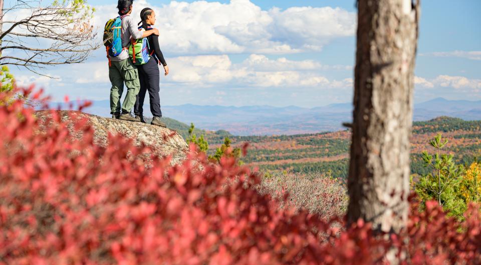 A couple looking out at the views from Treadway Mountain.