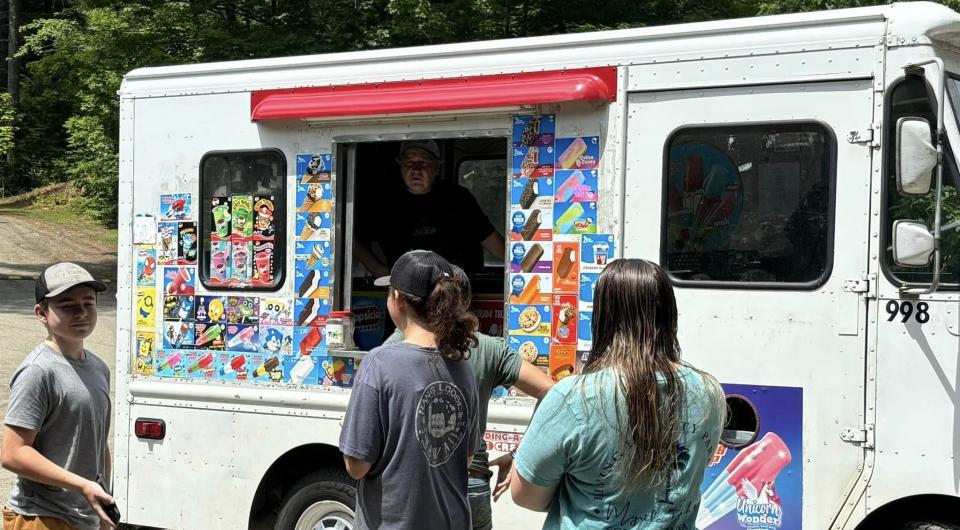 Kids enjoying a sweet treat from the ice cream truck