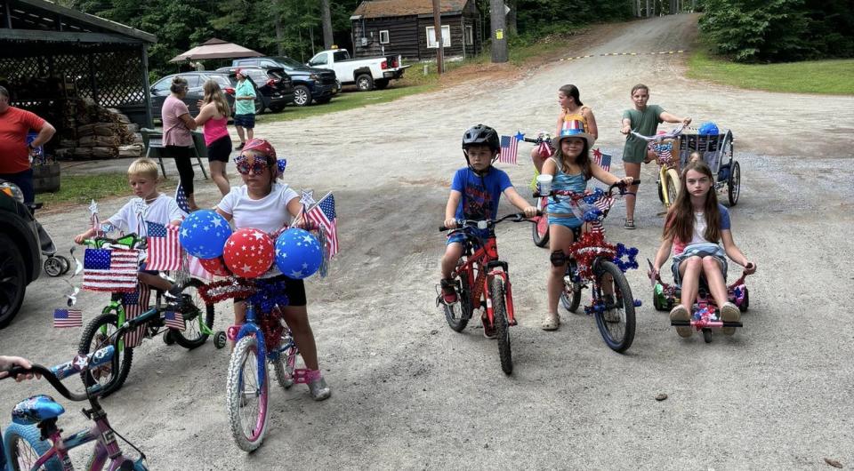 Kids on bikes decorated to celebrate Independence day