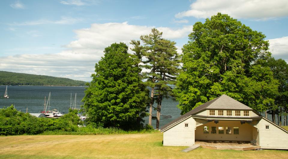 View of a park and pavilion by the lake