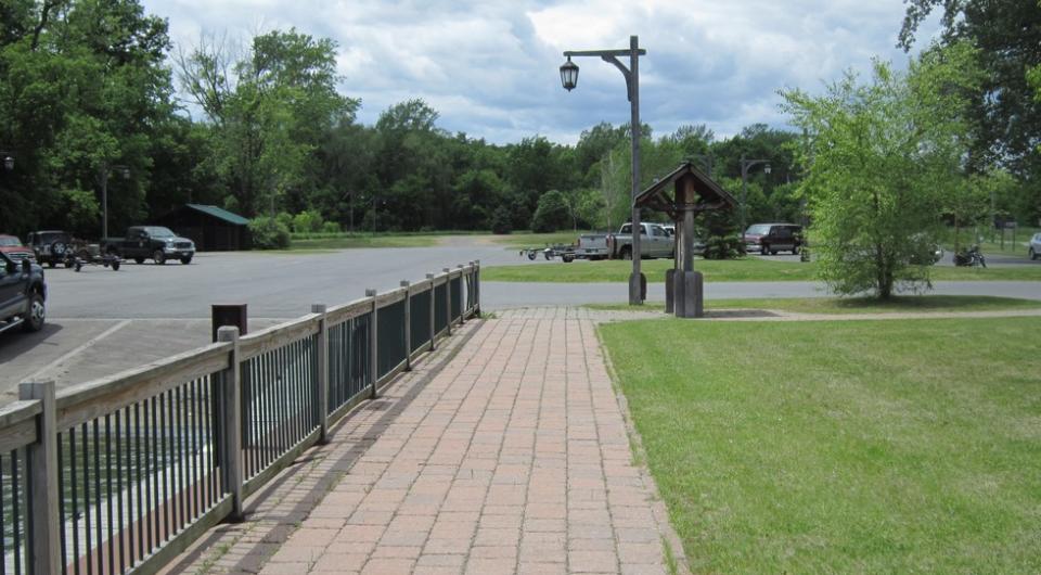 The side walk leading up to a boat launch.