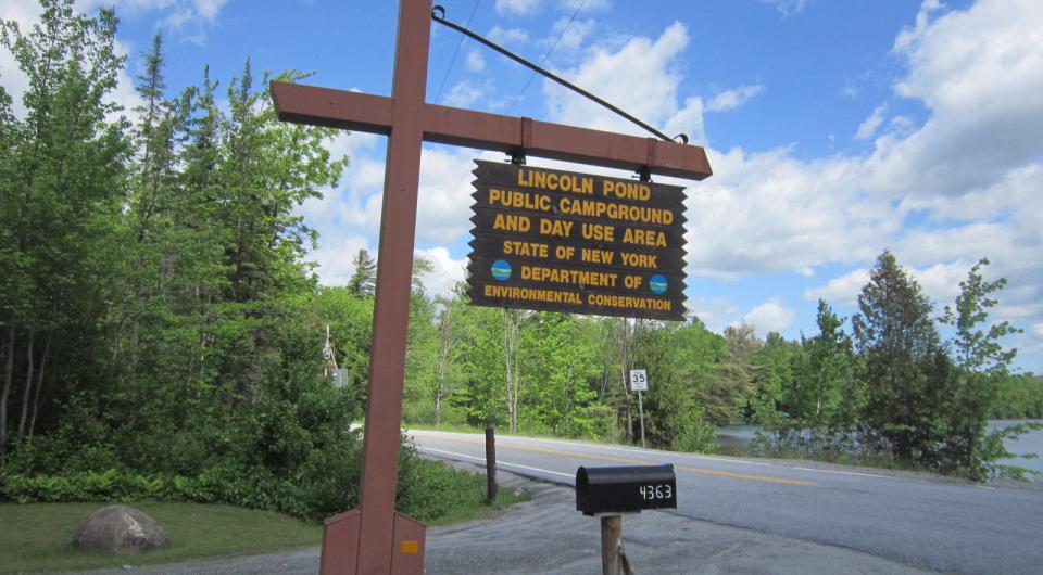 A large wooden sign for Lincoln Pond Campground