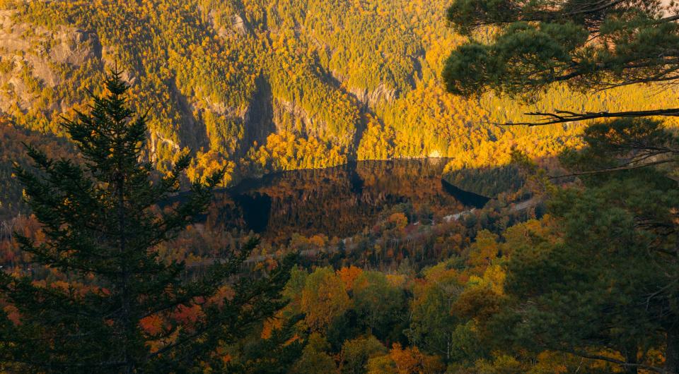 Looking down at a road and cliffs in the fall