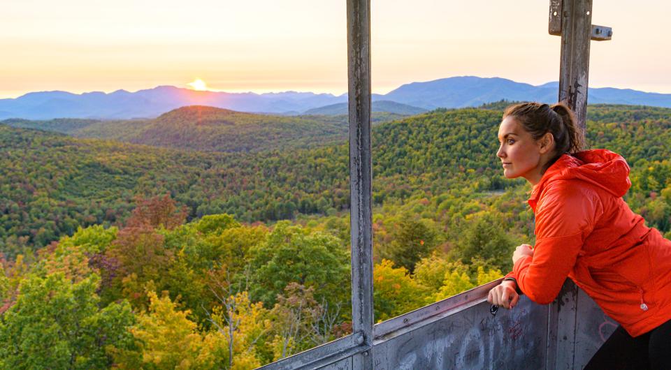 A woman looking out from a firetower