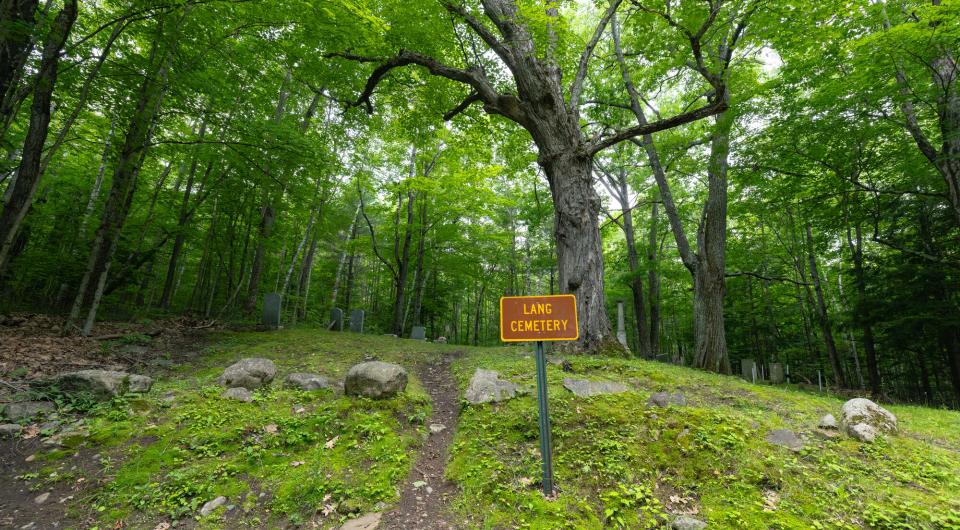 A sign for Lang Cemetary along the trail.