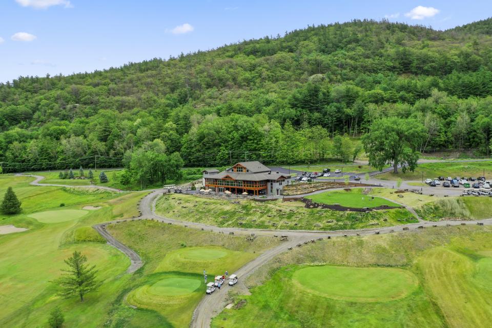 A golf course and lodge at the center of it