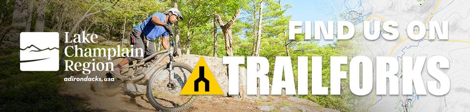 A banner for Trailforks.com featuring a mountain biker