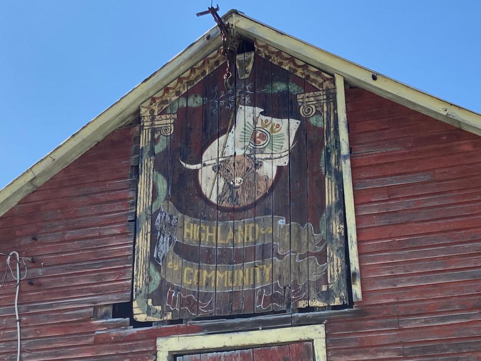 a barn with a "Highland Community" sign on the front.