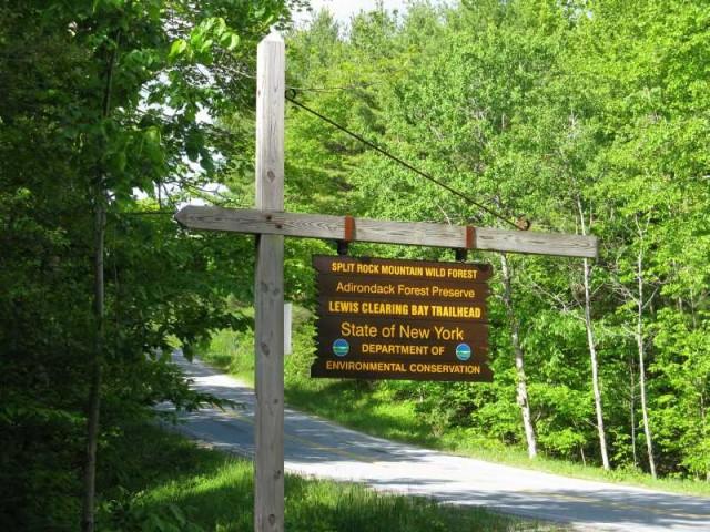 Roadside sign for the Lewis Clearing Bay Trailhead.