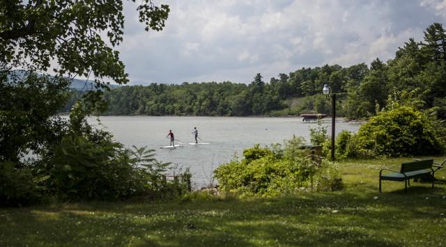 Paddle Boarders Enjoying The Lake.