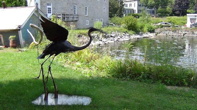 The garden has striking sculptures and water views.