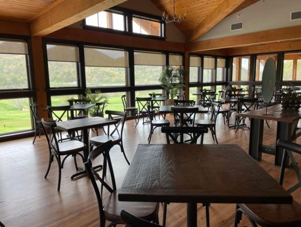 A view of tables and chairs inside The Tap Room