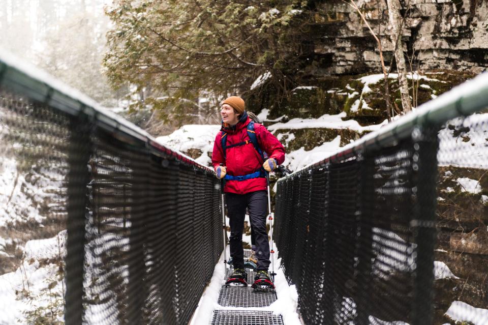 Man walking across the bridge