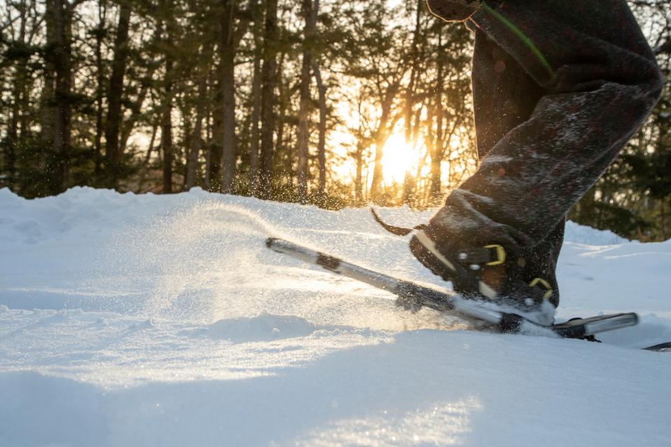 Snowshoe with sun in background