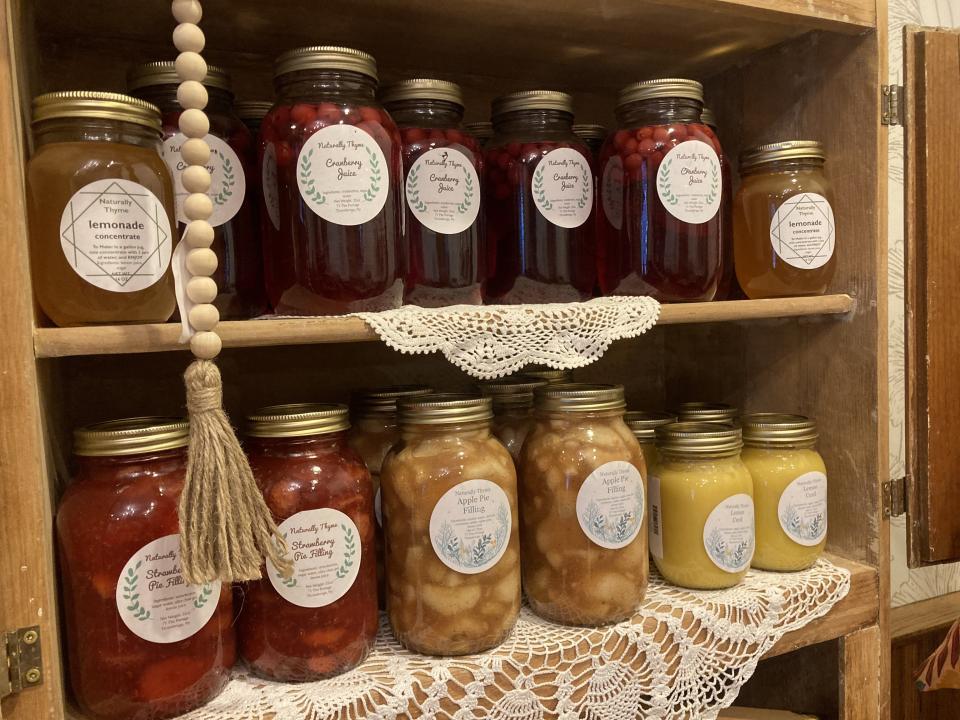 Canned veggies on a wooden shelf