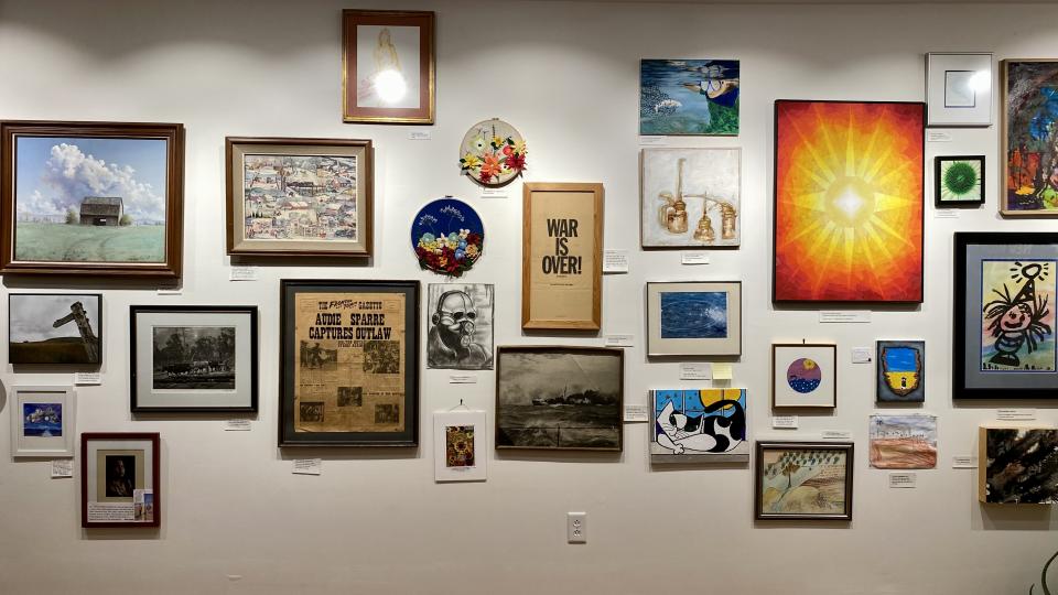 A display wall containing an art installation in Whitcomb's Arts