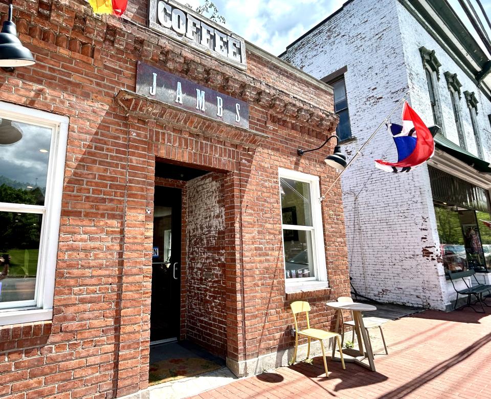 The brick exterior of a cafe.