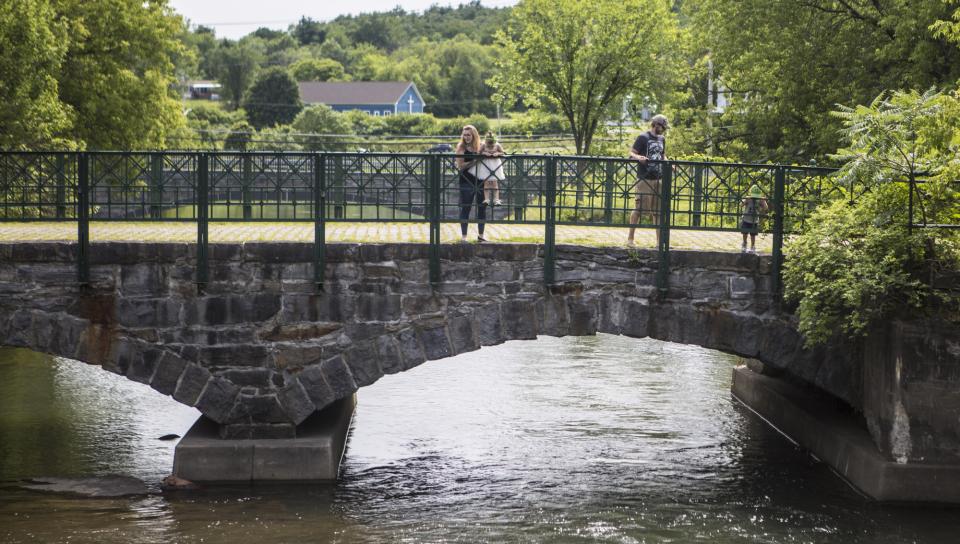 people enjoying the lachute river walk trail