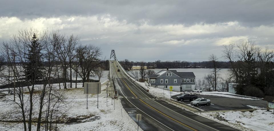 A bridge with a visitors center nearby