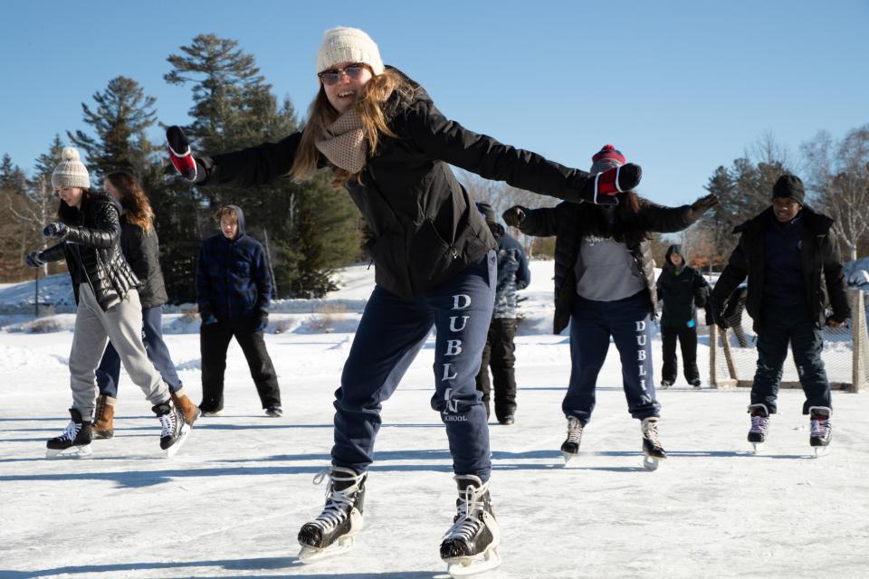 A group of young people skating