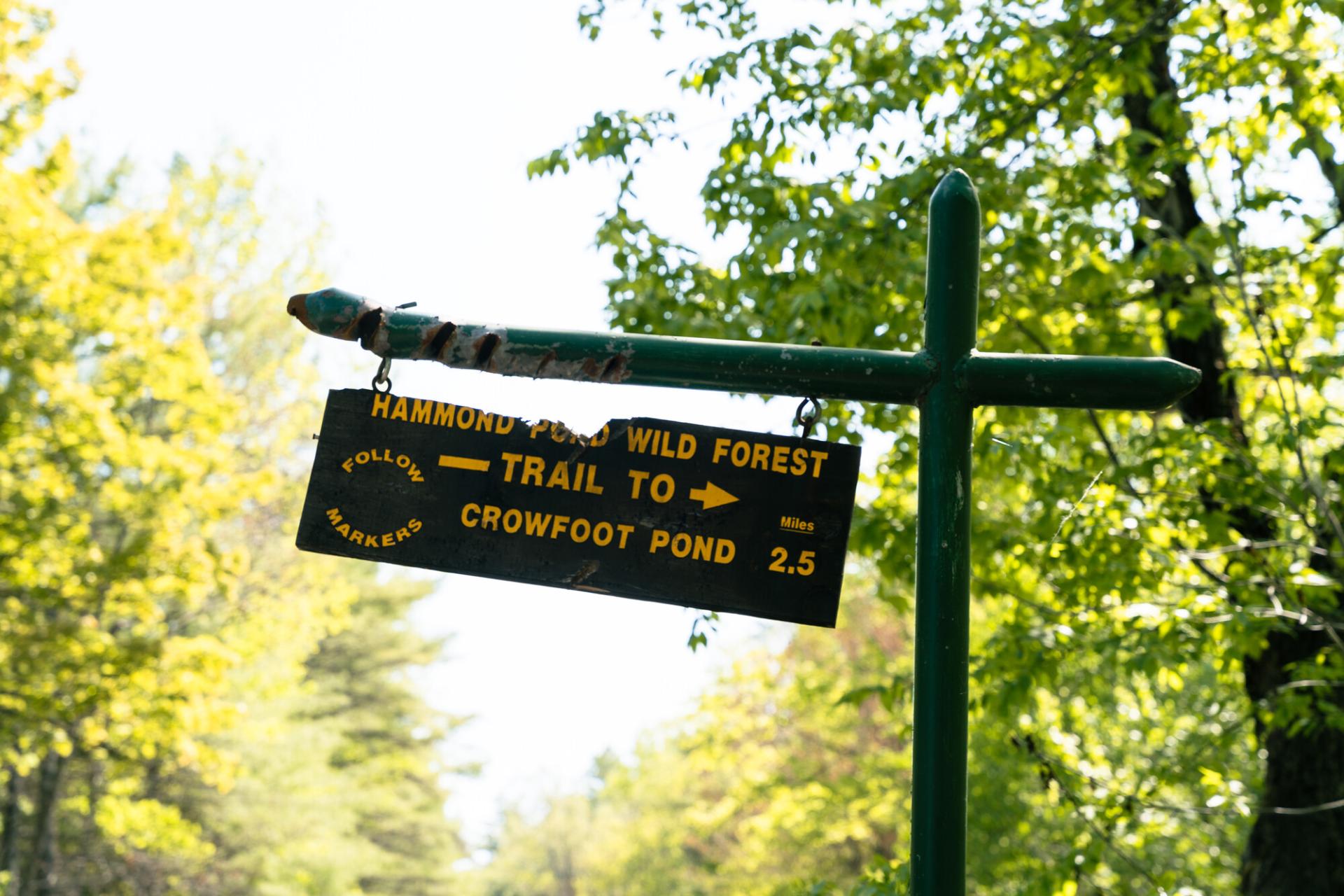 A sign for Crowfoot Pond