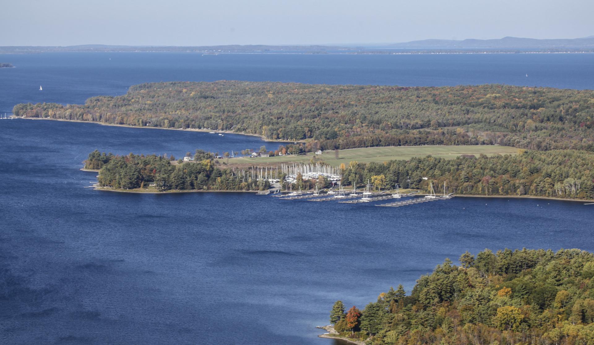 Aerial view of a peninsula on Lake Champlain in the fall.