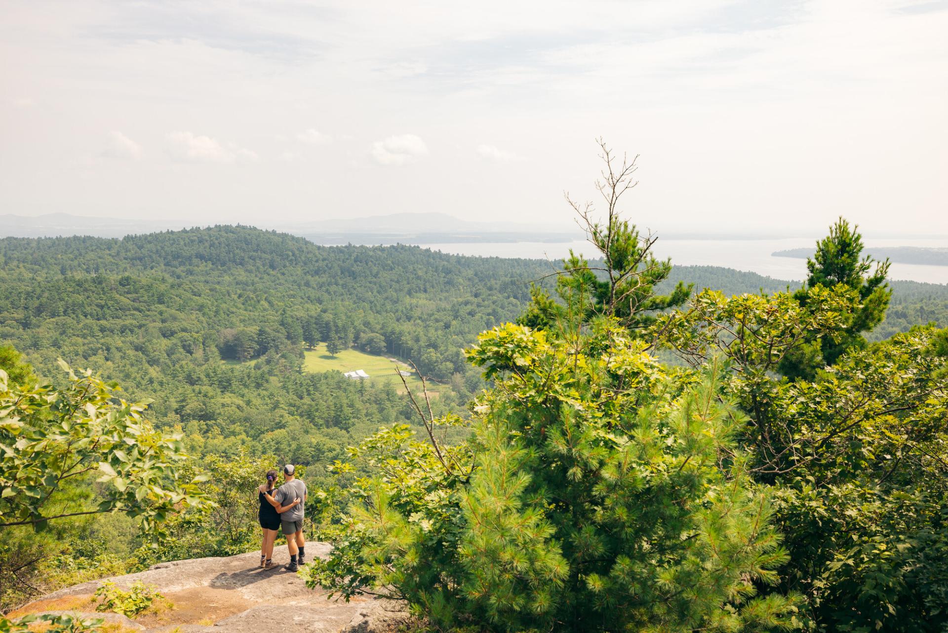 Two people on the summit of Coon Mountain